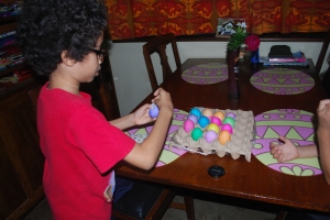 Dalton's decorating his eggs