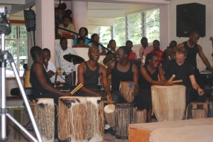 Joash, Excel, and other students during a concert performance