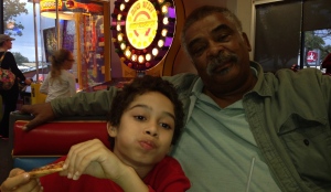 Dalton and my dad at Chuck E. Cheese's