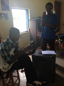 Excel and Hussein preparing for a rehearsal